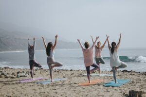 group yoga on the beach