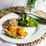 Pesto chicken, quinoa, and broccoli on white plate
