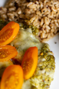 close up picture of pesto chicken and quinoa