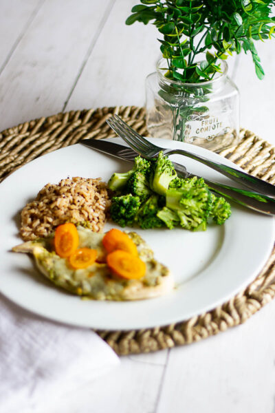 Pesto chicken, quinoa, and broccoli on white plate