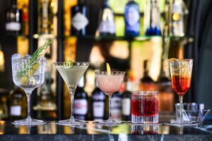 various drinks lined up on the bar