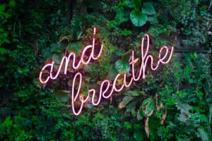 And Breath written in neon sign