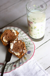 Applesauce Muffins on a plate with a glass of milk