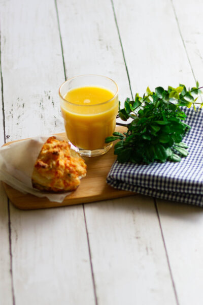 Biscuit egg sandwich with juice