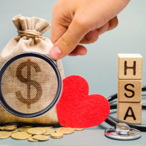 Blocks with HSA on them and small burlap bag of money
