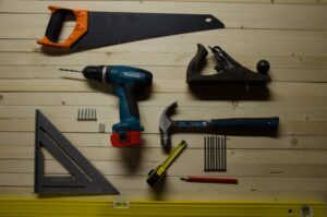 flatlay of tools on wood background