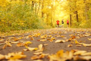 running in fall leaves