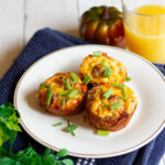 hash brown egg nests on plate with pumpkinand juice