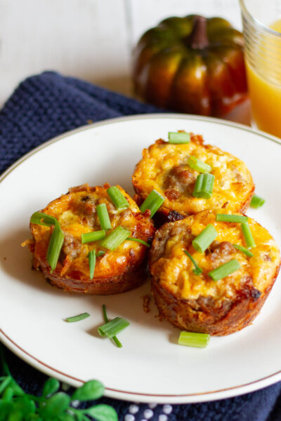 hash brown egg nests on plate with pumpkinand juice