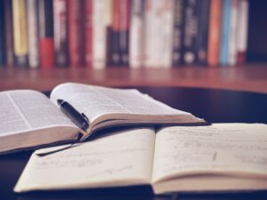 Books open on a table in a library