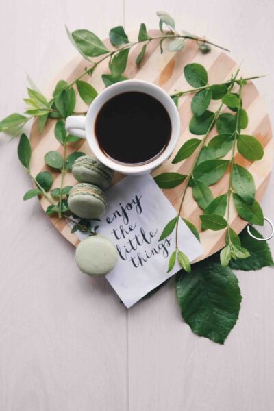 coffee cup with greenery and note