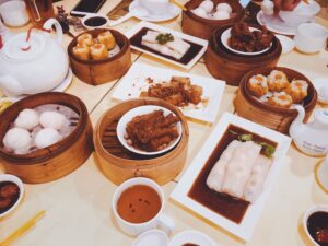 Plates of dim sum on table