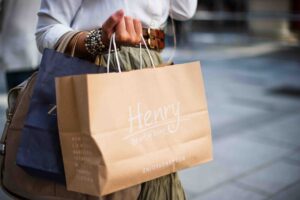 Woman holding a paper shopping bag