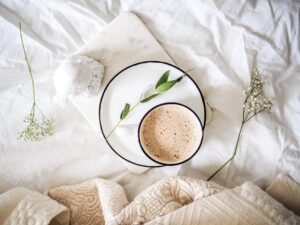 coffee cup on bed