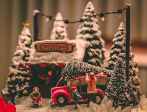 Christmas scene of toys, trees, covered in fake snow.