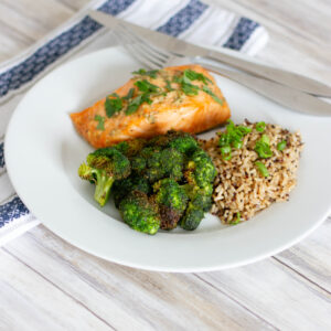 Plate of salmon, broccoli, and quinoa