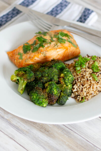 Plate of salmon, broccoli, and quinoa