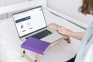 person working on laptop with screen open