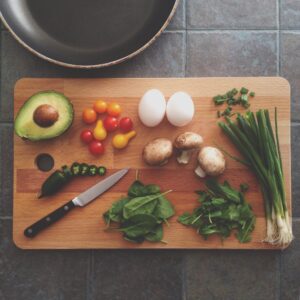 veggies on a wooden cutting board