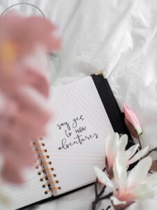 Journal open on a bed