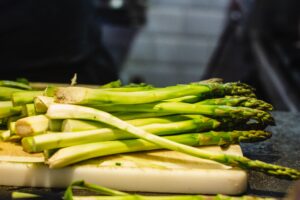 fresh picked asparagus on a cutting board