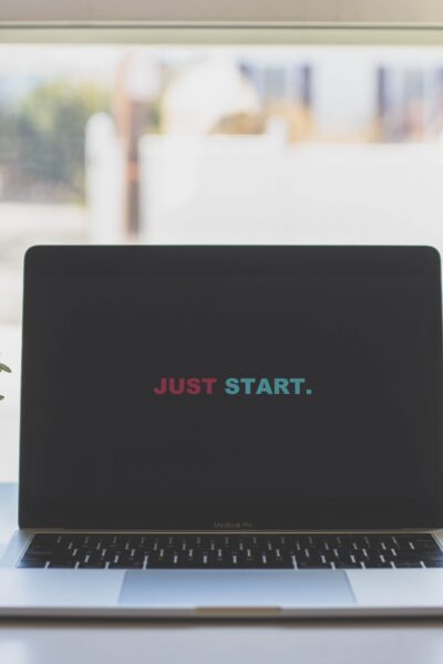 Laptop open to a screen that says Just Start