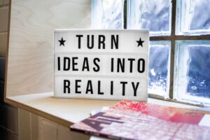 Black and white sign saying Turn Ideas into Reality
