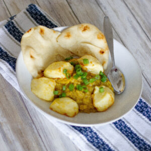 plate with air fryer halloumi and dahl dinner for two