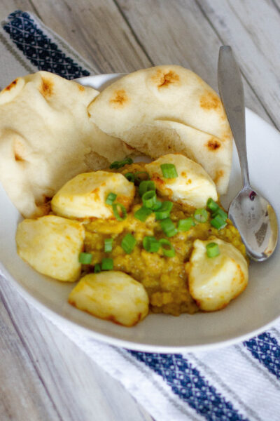 plate with air fryer halloumi and dahl dinner for two