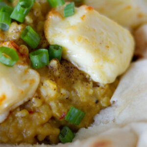 plate with air fryer halloumi and dahl dinner for two