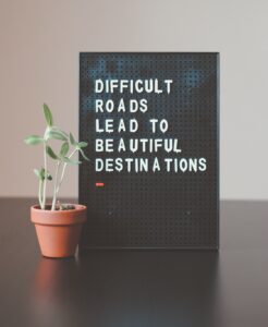 story board saying difficult roads leads to beautiful destinations