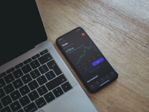 keyboard and phone showing stock quotes
